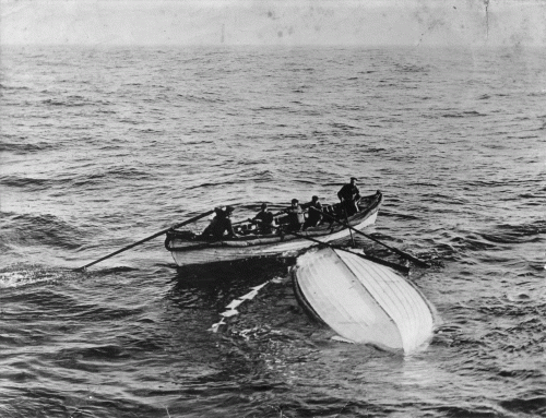A small rowboat with several people is seen near a capsized boat in a vast body of water.