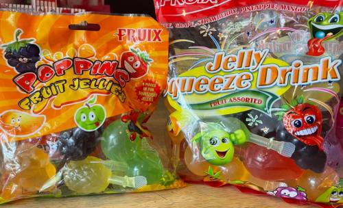 Two colorful bags of fruit-flavored jelly candies: "Popping Fruit Jellies" and "Jelly Squeeze Drink," featuring various fruit shapes.