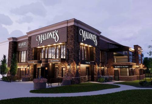 Exterior view of a restaurant named Malone's, featuring a patio and modern design, set in a landscaped area.
