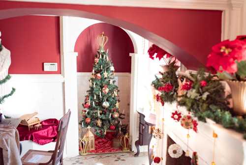 A cozy room decorated for Christmas, featuring a tree, festive garlands, and a warm, inviting atmosphere.