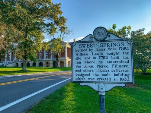 Historic marker for Sweet Springs, established in 1760, with details about its early history and notable visitors.