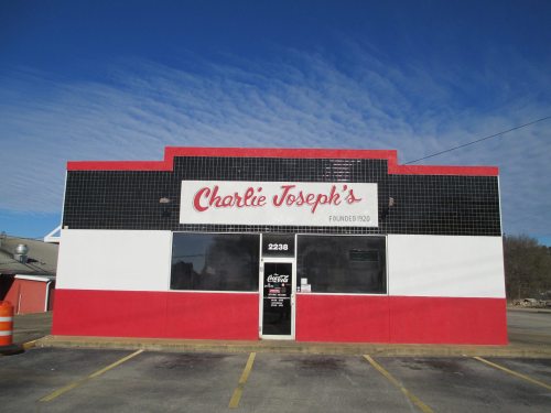 A colorful restaurant exterior featuring the name "Charlie Joseph's" in bold letters, with a blue sky above.