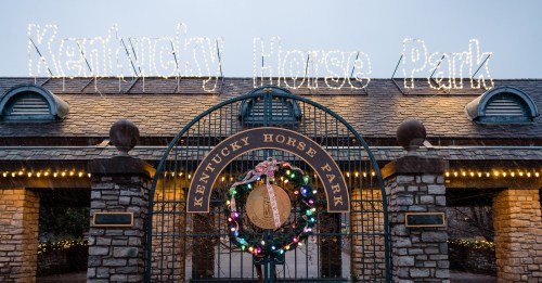 Entrance to Kentucky Horse Park, adorned with festive lights and a holiday wreath.