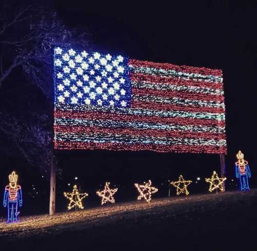 A large display of lights shaped like the American flag, surrounded by star decorations and nutcracker figures.