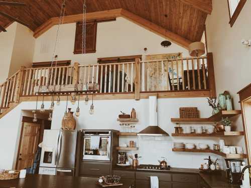 A modern kitchen with wooden accents, open shelving, and a lofted area above, featuring warm lighting and stylish decor.