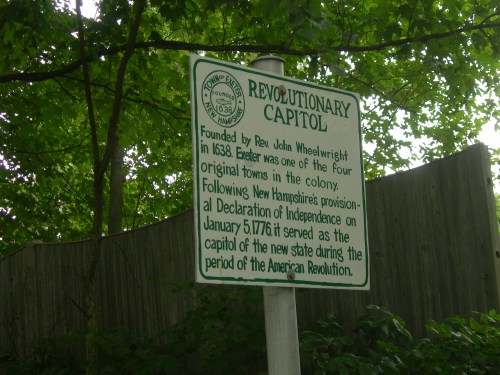 Sign about the Revolutionary Capitol in Exeter, New Hampshire, detailing its historical significance during the American Revolution.