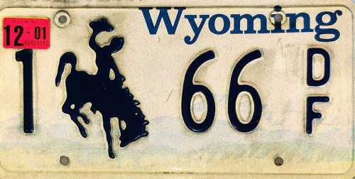 Wyoming license plate featuring a cowboy on a bucking horse, with the numbers 1, 66, and the letters DF.