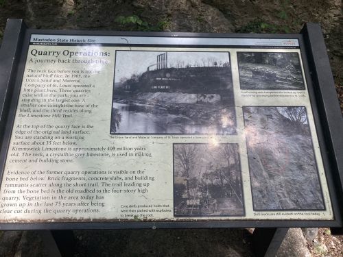 Information panel about quarry operations, detailing limestone extraction and its historical significance at the site.