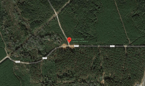 Aerial view of New Knight Family Cemetery surrounded by dense forest and roads.