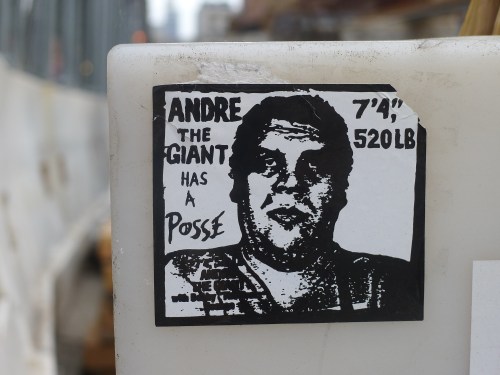 Sticker featuring a black and white illustration of Andre the Giant with text: "ANDRE THE GIANT HAS A POSSE."