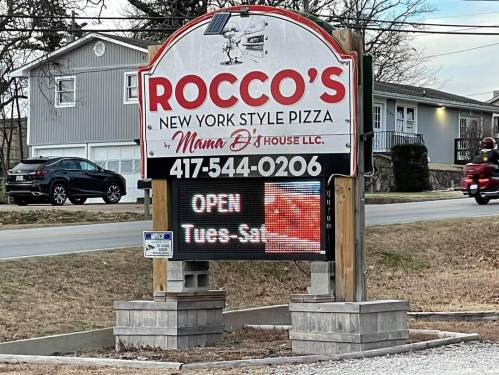 Sign for Rocco's New York Style Pizza, displaying "OPEN Tues-Sat" and contact number 417-544-0206.