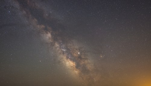 A stunning view of the Milky Way galaxy filled with stars and cosmic dust against a dark sky.