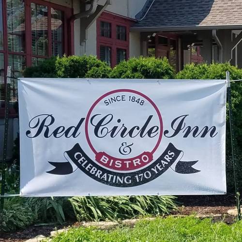 Banner for Red Circle Inn & Bistro, celebrating 170 years since 1848, displayed outside the establishment.
