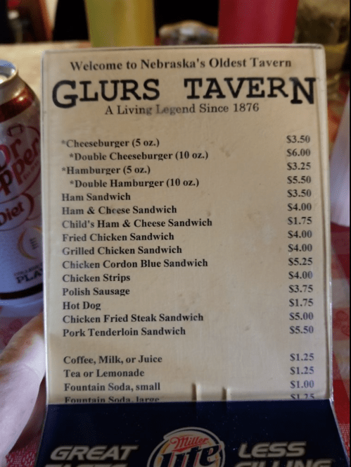 Menu from Glurs Tavern, Nebraska's oldest tavern, featuring various sandwiches and prices.
