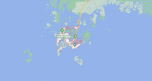 Map of Cedar Key, Florida, highlighting parks, trails, and wildlife refuge areas.