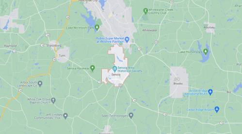 Map of Senoia, Georgia, highlighting local landmarks and surrounding areas, including parks and roads.