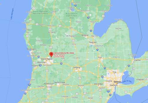 Map showing Michigan with a red marker indicating the location of Cannonsburg Ski Area near Grand Rapids.