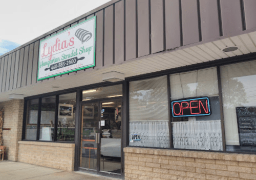 Exterior of Lydia's Hungarian Strudel Shop, featuring an "OPEN" sign and a welcoming storefront.