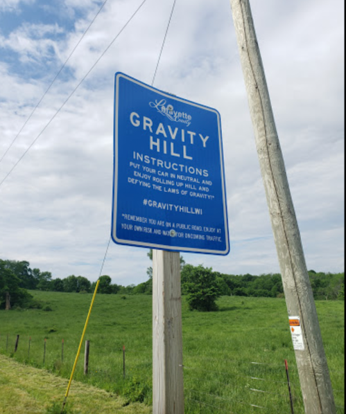 Sign at Gravity Hill with instructions to put your car in neutral and experience the illusion of rolling uphill.