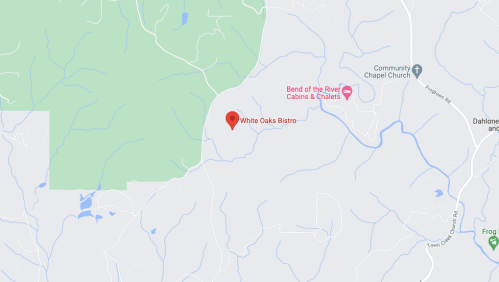 Map showing the location of White Oaks Bistro, near Bend of the River Cabins & Chalets, surrounded by green areas.