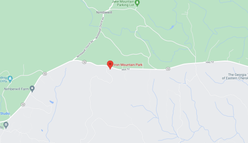 Map showing Iron Mountain Park location, with nearby roads and green areas indicating surrounding landscape.