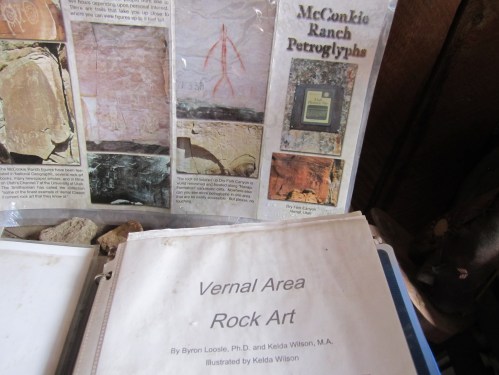 Display of rock art information, featuring McConkie Ranch petroglyphs and a document titled "Vernal Area Rock Art."