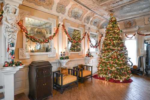 A beautifully decorated room featuring a large Christmas tree, festive garlands, and ornate mirrors.