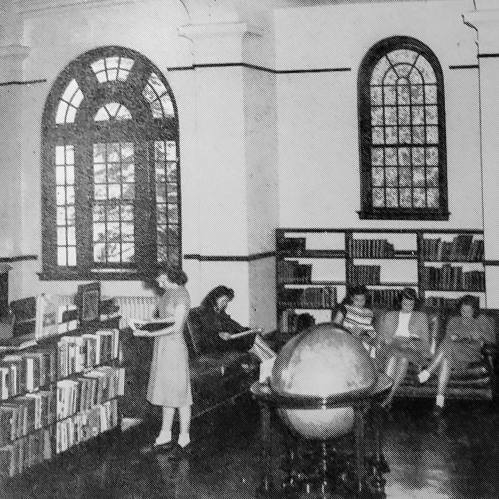 A vintage library scene with bookshelves, a globe, and people reading and browsing books.