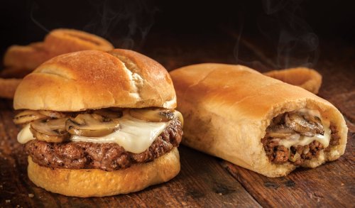 Two delicious sandwiches: one with a beef patty, melted cheese, and sautéed mushrooms, and another filled with seasoned meat.
