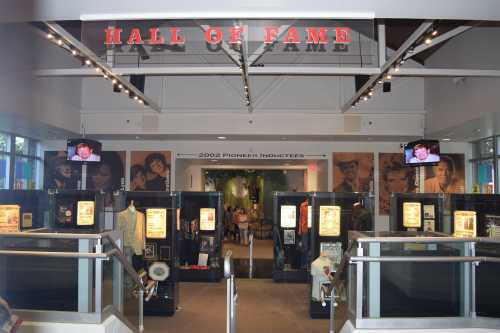 Entrance to a Hall of Fame exhibit featuring displays and screens showcasing inductees and memorabilia.