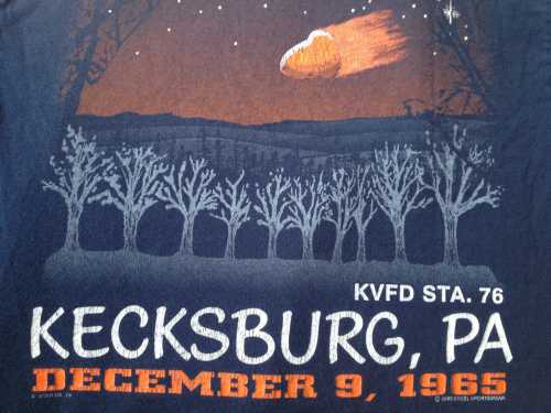 T-shirt design featuring a comet over trees, with "Kecksburg, PA December 9, 1965" and "KVFD STA. 76" text.