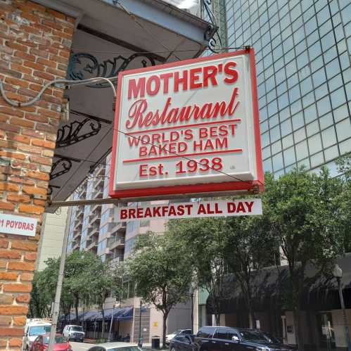 Sign for Mother's Restaurant featuring "World's Best Baked Ham," established in 1938, with "Breakfast All Day" below.