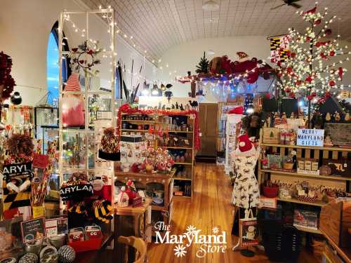 A cozy gift shop filled with Maryland-themed items, holiday decorations, and festive lights.