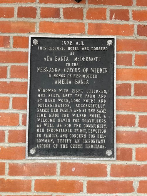 Plaque honoring Ada Barta McDermott for her contributions to the Wilber community and Czech heritage in 1978.