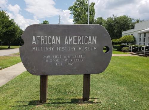 Sign for the African American Military History Museum, located at 305 East 6th Street, established in 1942.