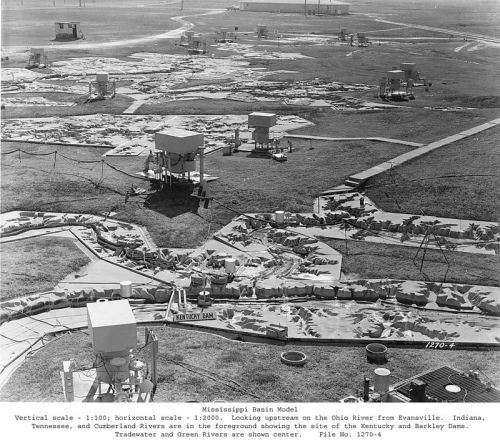Black and white aerial view of a model of the Mississippi Basin, featuring rivers and dams in a landscape layout.