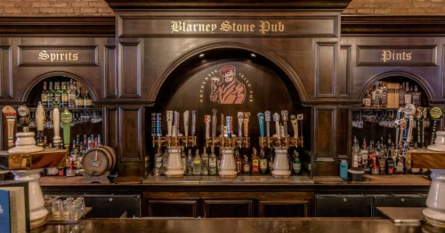 The draft beer station at Blarney Stone Pub showcasing "Spirits" and "Pints" wooden arches.