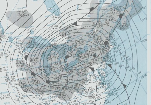 Weather map showing isobars, pressure systems, and precipitation patterns over a region, with varying pressure values.