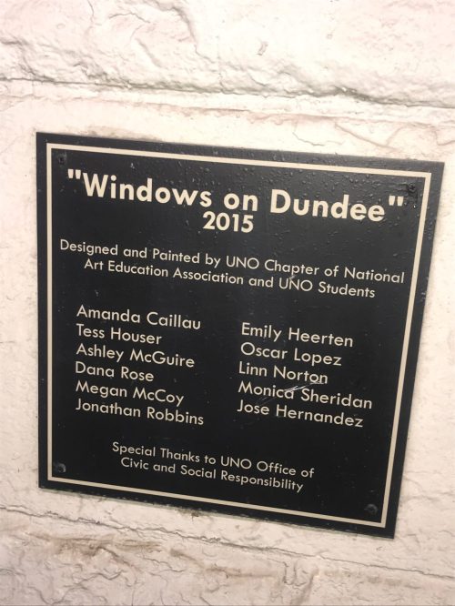 Plaque titled "Windows on Dundee" (2015) listing artists and contributors from UNO Chapter of National Art Education Association.