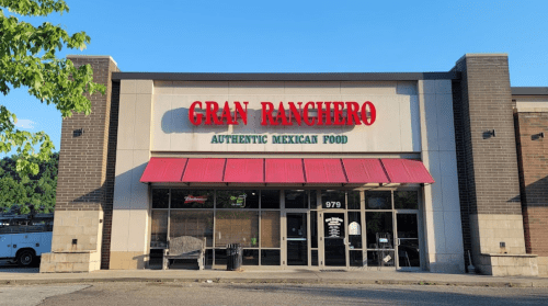 Exterior of Gran Ranchero restaurant, featuring a red awning and sign that reads "Authentic Mexican Food."