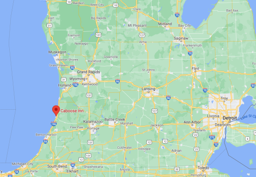 Map showing southwestern Michigan with a marker for Caboose Inn near the coast, south of Benton Harbor.