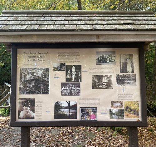 Information board about Madame Sherri, featuring historical photos and text about her life and castle.