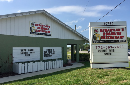 Signage for Sebastian's Roadside Restaurant, featuring breakfast, lunch, and dinner options, with a prime rib special.