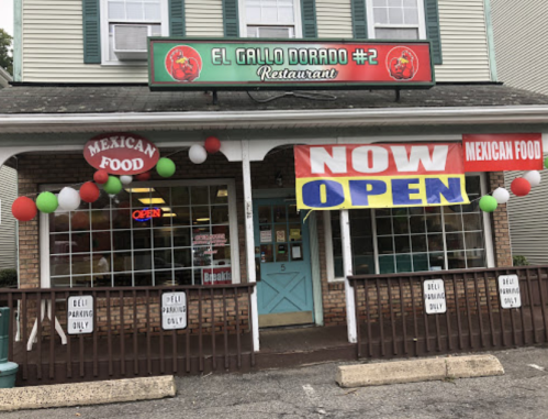 Exterior of El Gallo Dorado #2 restaurant, featuring a "NOW OPEN" sign and festive decorations in red, green, and white.