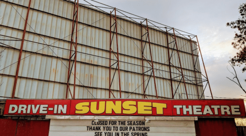 Sign for the Drive-In Sunset Theatre, stating it's closed for the season and will reopen in spring.