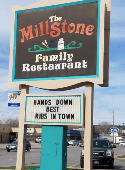 Sign for The Millstone Family Restaurant, featuring a message that reads "Hands Down Best Ribs in Town."