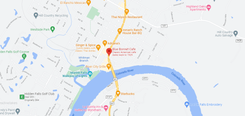 Map showing a section of Marble Falls, Texas, highlighting restaurants, the Colorado River, and local landmarks.