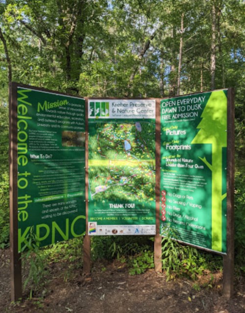 Signboard at Keeshen Preserve & Nature Center with information on the mission, activities, and visiting hours.