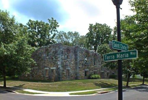 Ruins of a stone building surrounded by trees at the intersection of Saint Charles and Terra Maria Way.