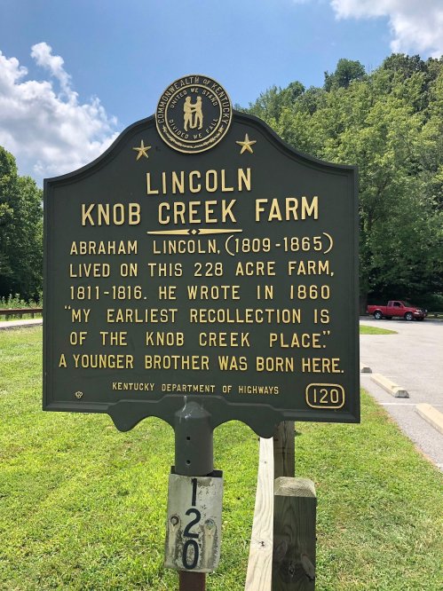 Historical marker for Lincoln's Knob Creek Farm, noting Abraham Lincoln's early life and memories of the place.